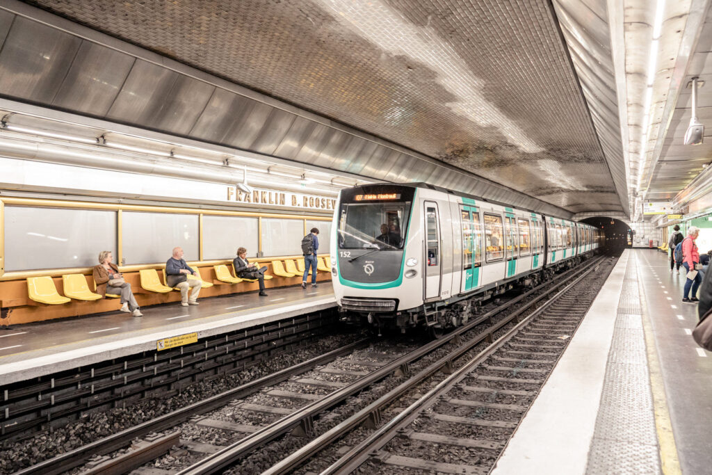 The metro train pulling into the station in Paris