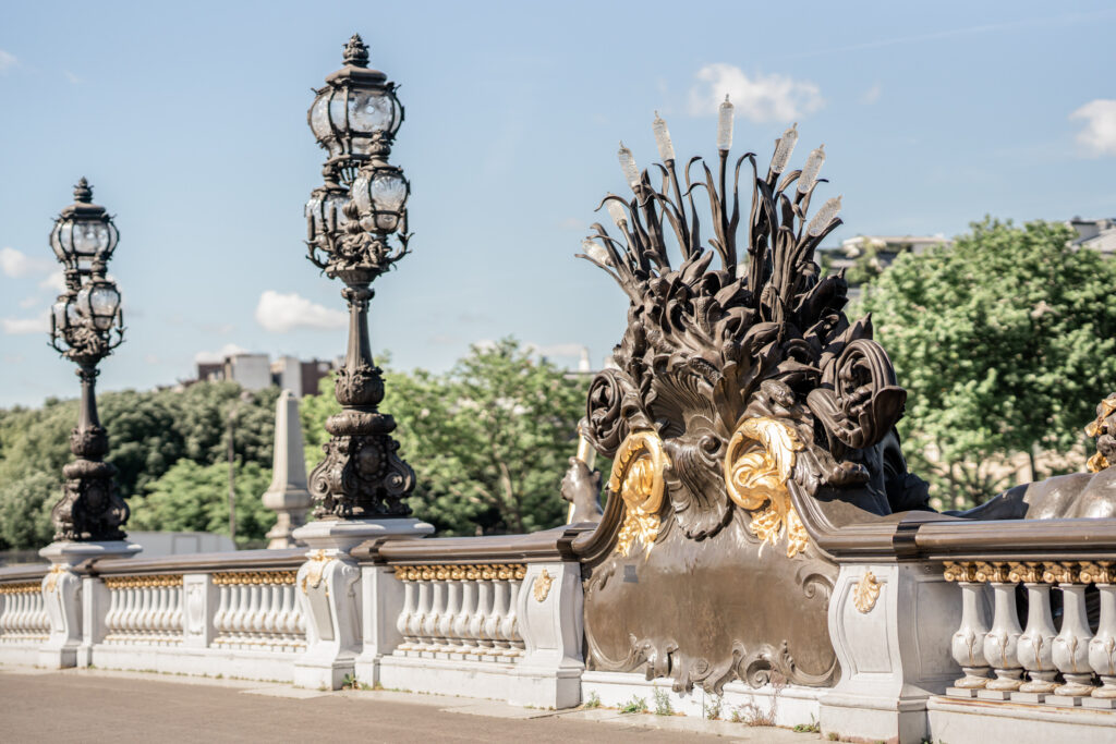 The bronze sculpture and lamp on the Pont Alexandre III Bridge in Paris