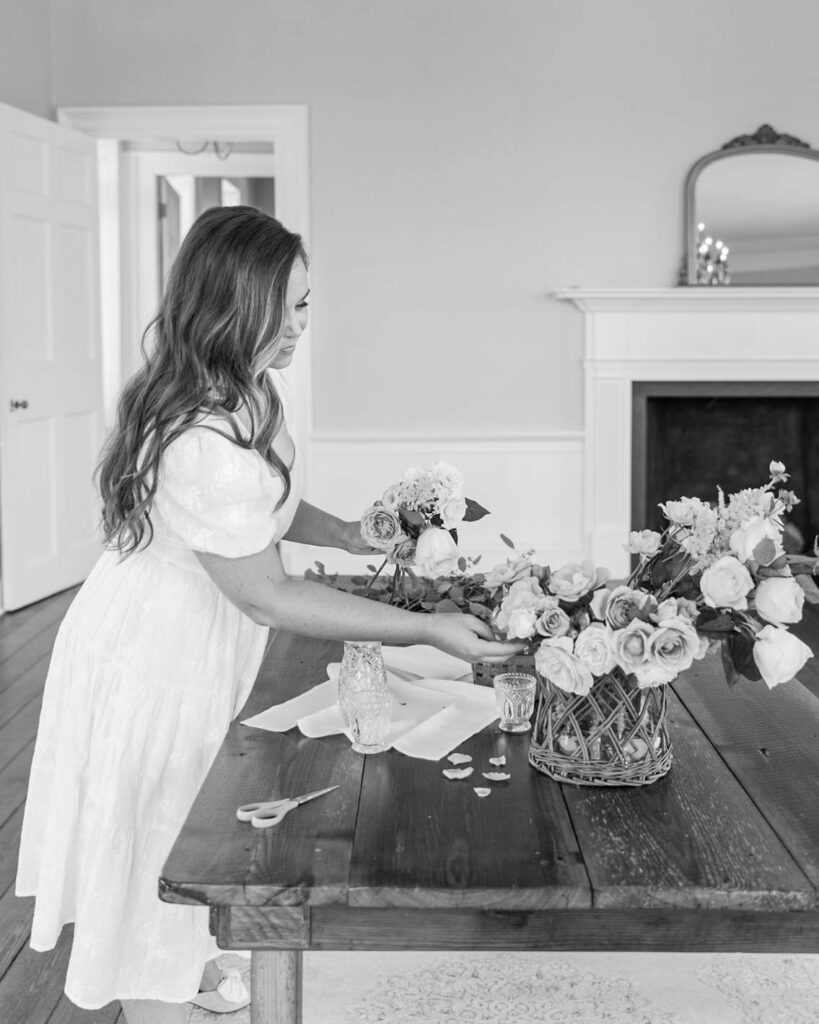 A wedding planner arranging the table