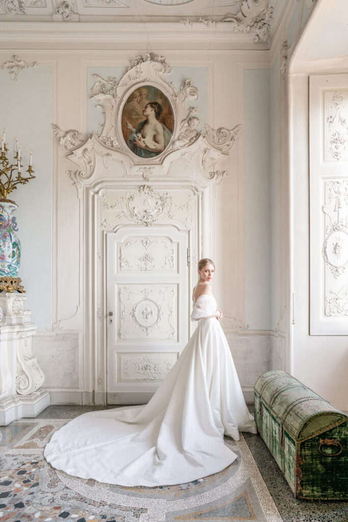 Full length of bride posing in an ornate room at villa sola cabiati
