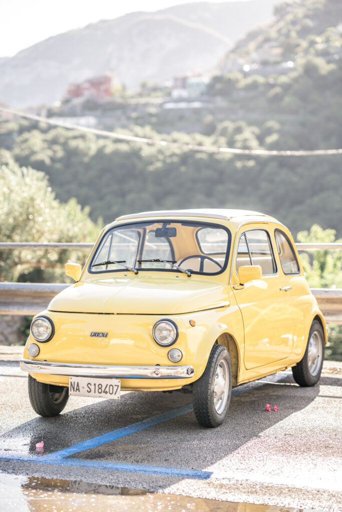 Vintage yellow Fiat 500 in italy