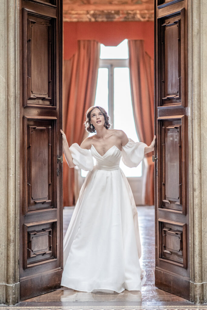 Bride posing against the internal doors at Villa Erba on Lake Como in Italy