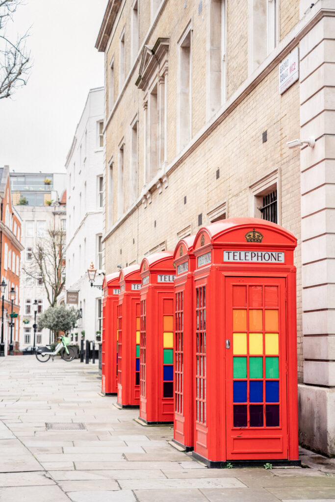 A line of red telephone boxes in London