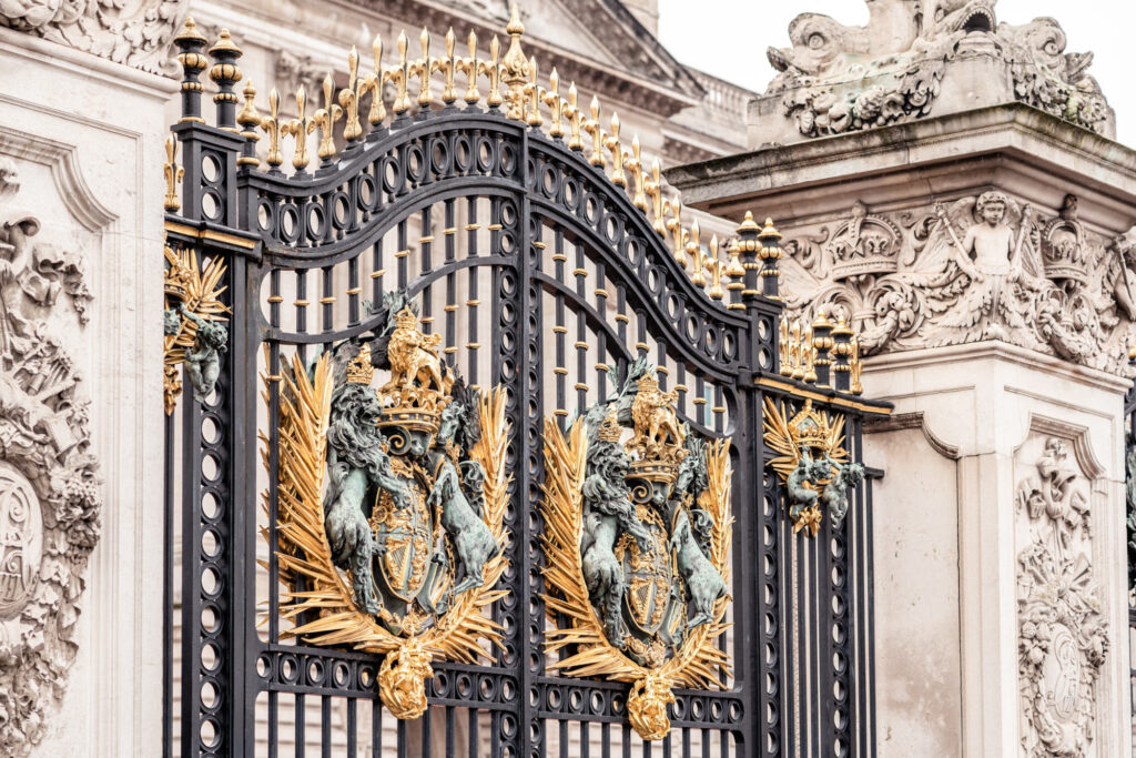 The ornate gold and black gates at Buckingham Palace