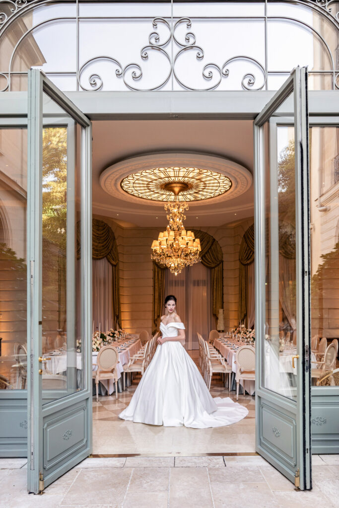 Bride posing in a ballgown wedding dress at the Ritz Hotel in Paris