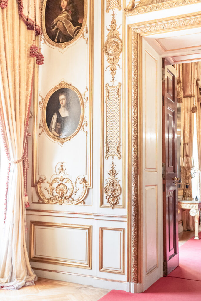 The gold detailing and panelled walls inside a state room at Blenheim Palace wedding venue in Oxfordshire