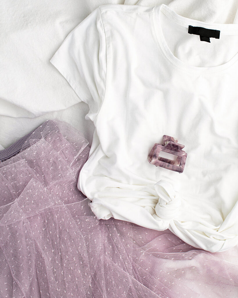 Evening outfit for holiday with a crisp white tee, pink tulle skirt and hair clip