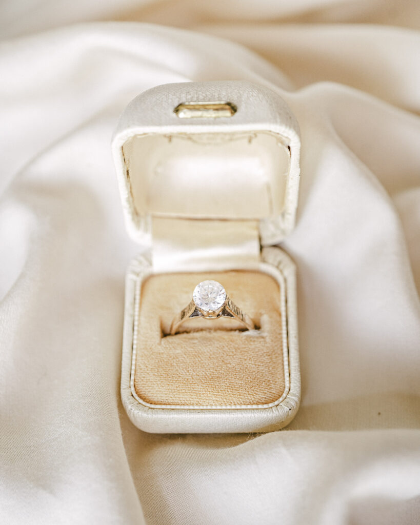 A large diamond engagement ring in a jewelry box.