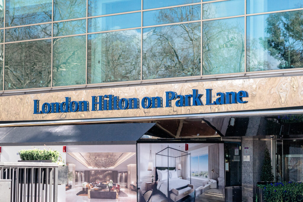 A close up of the The London Hilton, Park Lane hotel sign in London