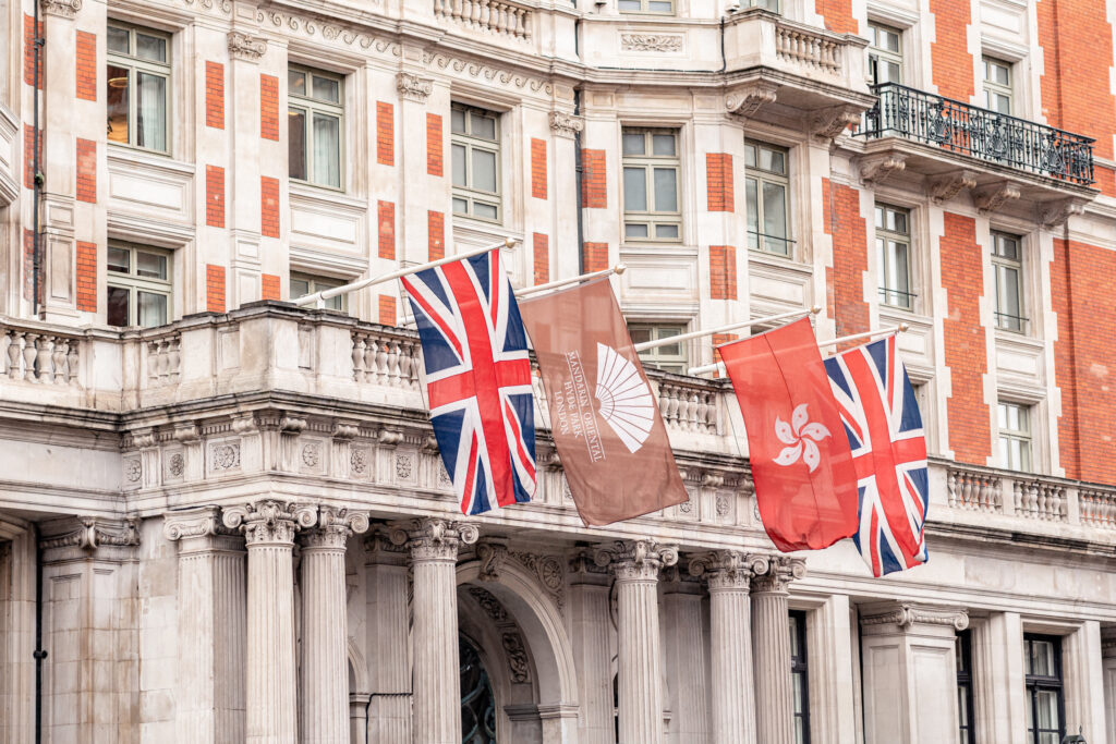 A close up of the flags above the entrance at the Mandarin Oriental Hotel Hyde Park in London.