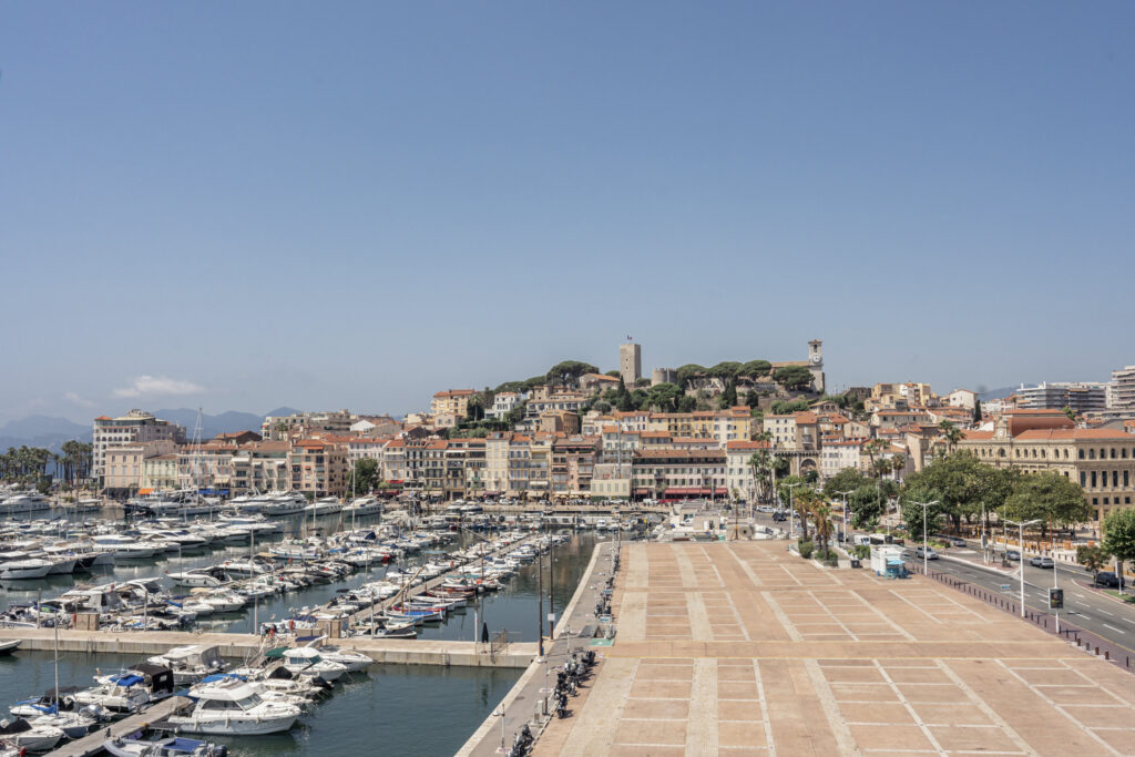 Cannes harbor and town.