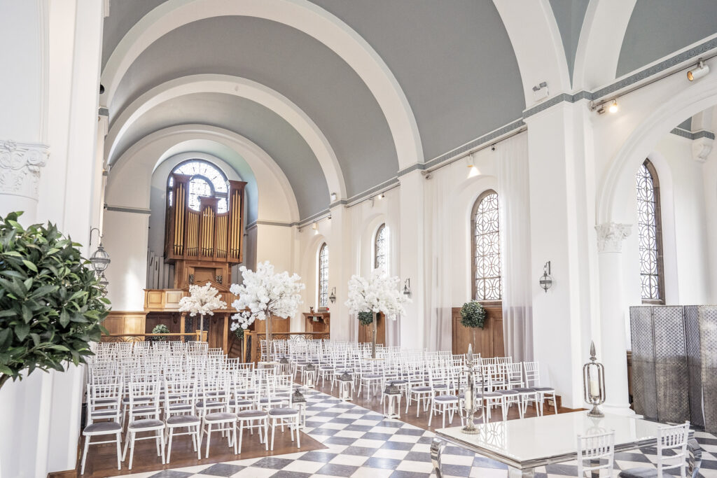 The inside of the chapel set for a wedding ceremony, from the front, at Hawkstone Hall Shropshire venue.