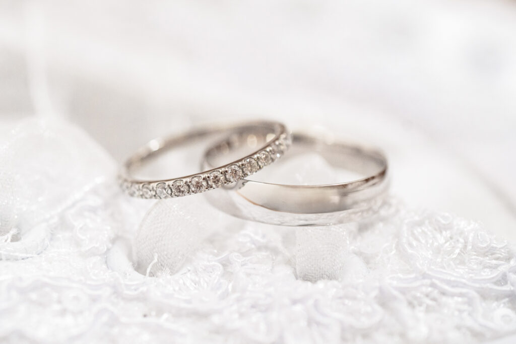 Platinum diamond wedding rings bands on lace