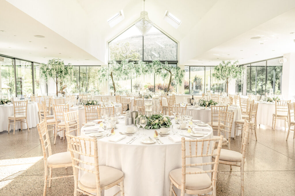 The garden room dressed for a wedding breakfast at Tyn Dwr Hall.