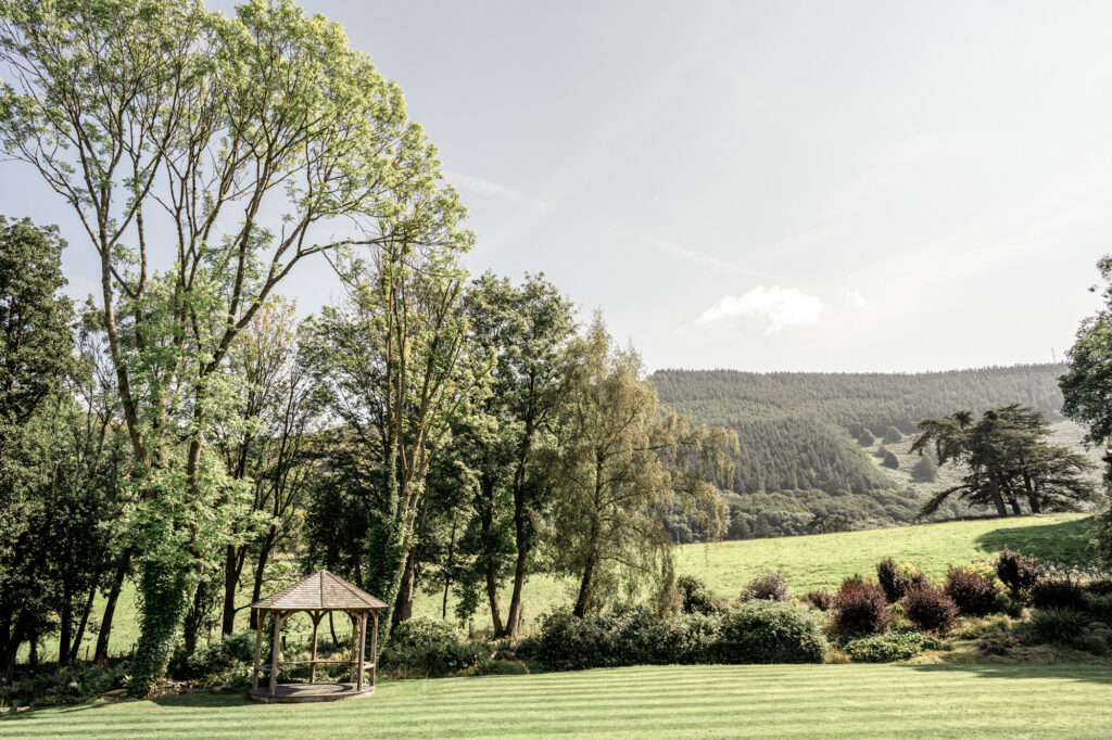 Lush gardens and views over the Welsh countryside from Tyn dwr Hall