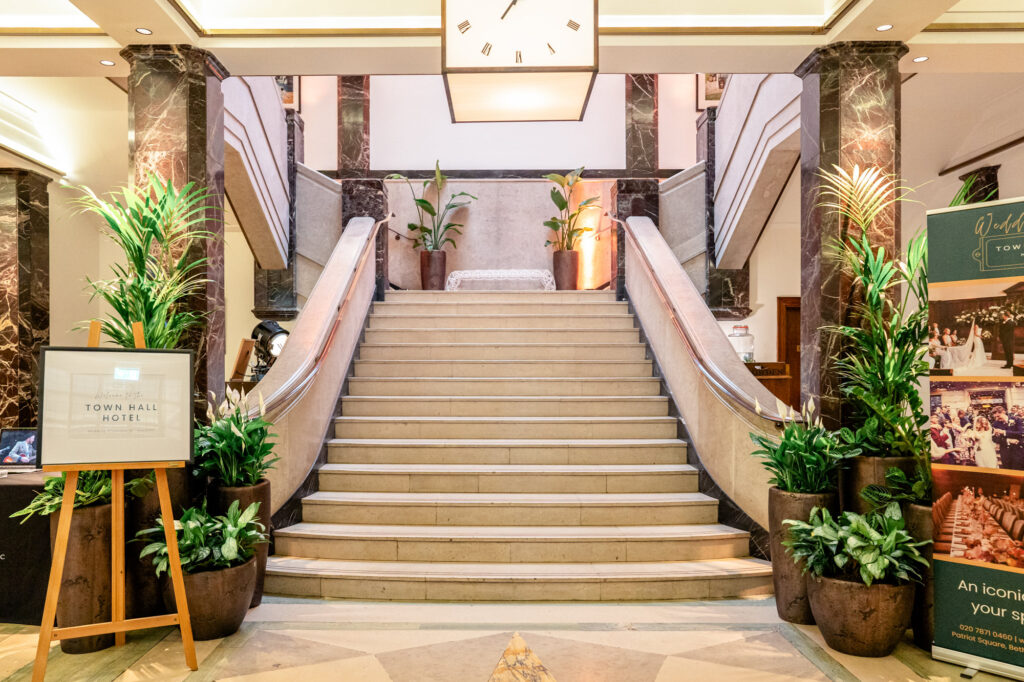The grand staircase in the lobby at the Town Hall Hotel wedding venue in London